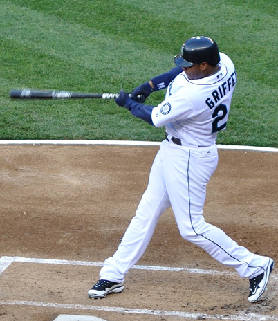 A baseball player swinging at the ball