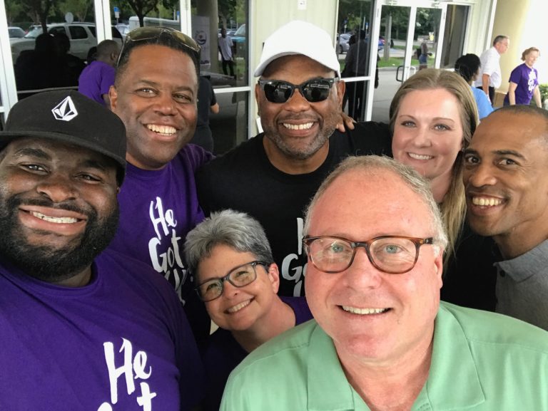 A group of people that are standing together.